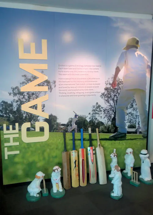 The Game display of cricket at the Bradman Museum with five cricket bats