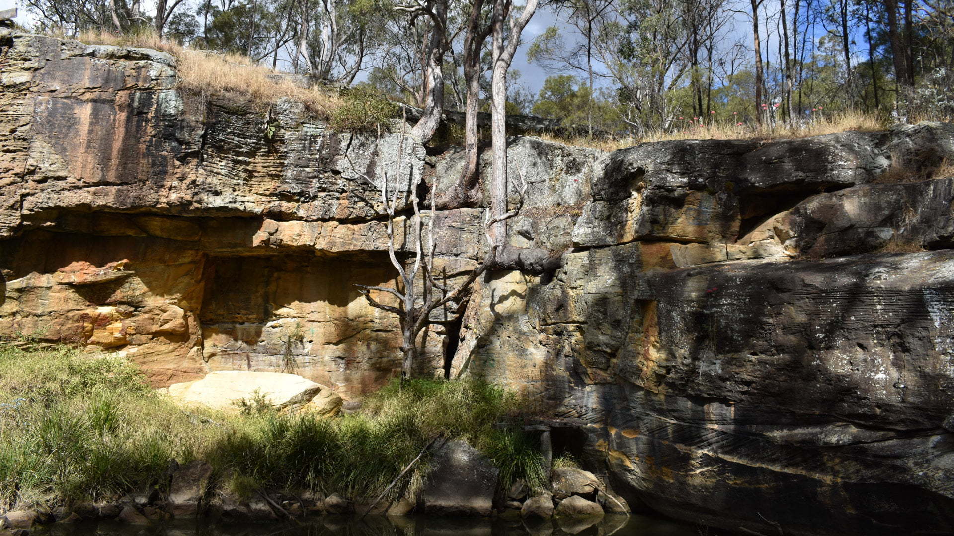 Rock walls at the Pump Hole on the trail walk in Crows Nest. The walk starts at Bullocky's Rest Park and follows Applegum Walk along Crows Nest Creek and Bald Hills Creek to Hartmann Park, then through the township of Crows Nest