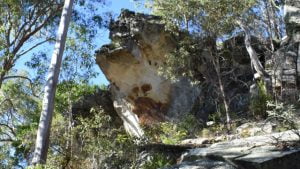 Rock outcrop with a dark mark that looks like a footprint, at the Cania Gorge National Park on the Big Foot Walk