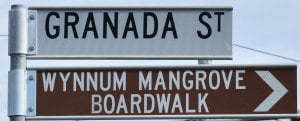 Brown sign for Wynnum Mangrove Boardwalk, sign for Grandada St