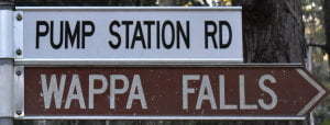 Brown sign for Wappa Falls, white sign for Pump Station Rd