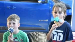 Two boys enjoying ice-cream, from Scoopy's near Bongaree Jetty on Bribie Island