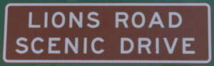 Brown sign for Lions Road Scenic Drive