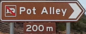 Brown sign for Pot Alley, 200m