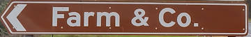 Brown sign for Farm & Co